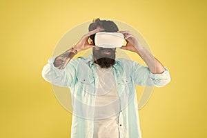 Eye tracking. Testing software. Bearded man yellow background vr glasses. Digital future and innovation. Developing