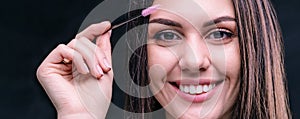 Eyebrow master. Face of beautiful girl close up in studio. Banner