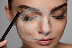 Eyebrows Contouring. Beautiful Woman With Brown Eyebrow Pencil