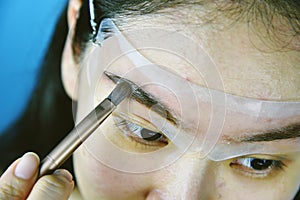 Eyebrows shaping makeup template, Asian women filling eyebrows to look thicker.