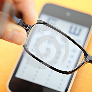 Eyechart on mobile with eyewear photo