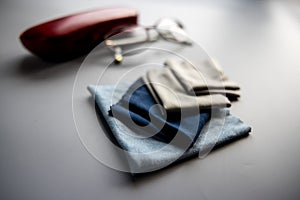 Eyeglass Cleaning Cloths with eyeglass case on gray background
