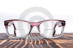 Eyeglasses with bifocal lenses, plastic frame photo