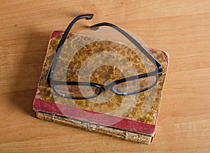 Eyeglasses on the book.