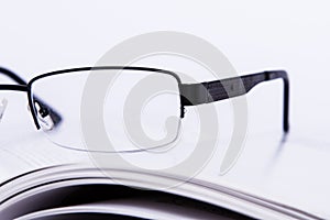 Eyeglasses on Book