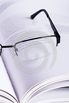 Eyeglasses on Book