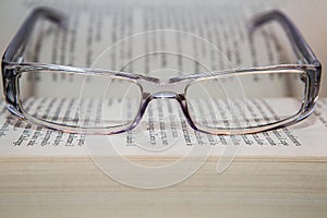 Eyeglasses with book photo