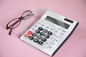 Eyeglasses with calculator on table