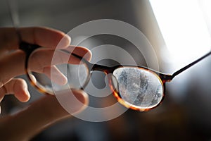 Eyeglasses with dirty marks on lens photo