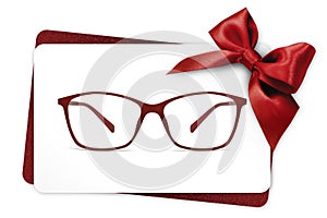 Eyeglasses gift card, red spectacles and red ribbon bow, isolate photo