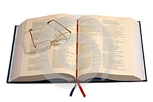 Eyeglasses lying on an old book