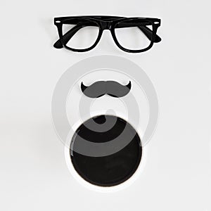 Eyeglasses, moustache and cup of coffee