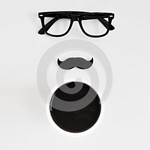 Eyeglasses, moustache and cup of coffee photo