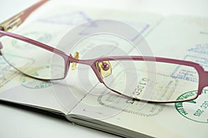 Eyeglasses on passport book