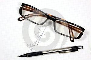 Eyeglasses and pen