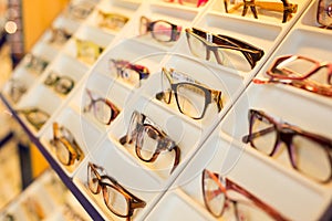 Eyeglasses, shades and sunglasses in optometrist's shop