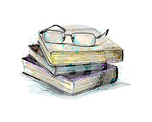 Eyeglasses on top stack books