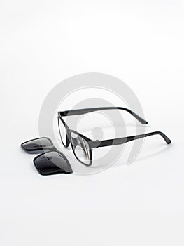Eyeglasses transformers 2in1 with a magnet. Glasses for computer work. Sunglasses on a white background.