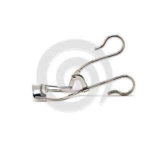 Eyelash curler on white background