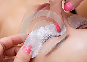 Eyelash extension procedure close up.