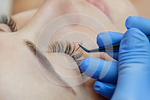 Eyelash extension procedure close up.