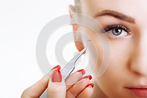 Eyelash Extension Procedure. Woman Eye with Long Eyelashes. Close up, selective focus.