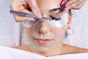 Eyelash Extension Procedure. Woman Eye with Long Eyelashes. Lashes, close up, macro, selective focus.