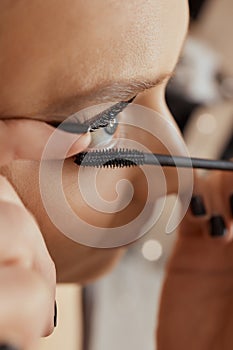 Eyelash Extension Procedure. Woman Eye with Long Eyelashes. Lashes. Close up, selected focus.