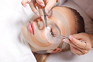 Eyelash Extension Procedure. Woman Eye with Long Eyelashes. Lashes, close up, selected focus.