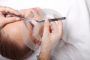 Eyelash Extension Procedure. Woman Eye with Long Eyelashes. Lashes, close up, selected focus.