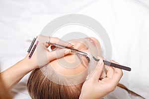 Eyelash Extension Procedure. Woman Eye with Long Eyelashes. Lashes, close up, selected focus.