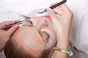 Eyelash Extension Procedure. Woman Eye with Long Eyelashes. Lashes, close up, selected focus.