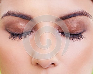 Eyelashes, face and closeup of woman with makeup, beauty or eyeshadow, shimmer or glow. Eyes, zoom and female model with