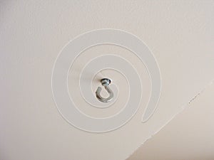 Eyelet-screw to fix things at a wall or ceiling, hook on the ceiling photo