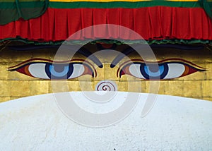 The eyes of Buddha painted over the dome of the Boudhanath Stupa, Kathmandu, Nepal