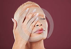 Eyes closed, hands and face skincare of woman in studio isolated on a red background mockup. Dermatology, makeup