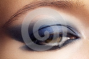 Eyes cosmetic, eyeshadow. Closeup fashion make-up