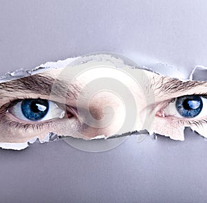 Eyes looking through gap