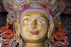 Eyes of Maitreya Buddha face close up. Thiksey Gompa. Ladakh, India