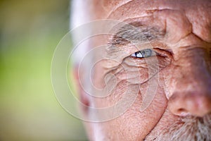 Eyes, vision and old man, face closeup and wisdom with focus, insight and thinking with mockup space. Elderly male