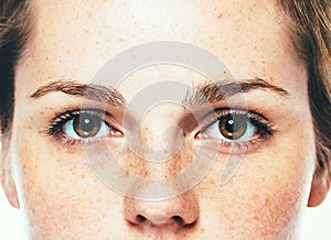 Eyes woman freckle happy young beautiful studio portrait with healthy skin photo