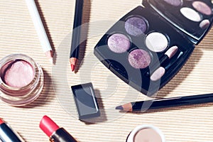 Eyeshadow palette, brow powder, primer, eye pencils and lipsticks