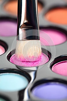 Eyeshadow set with makeup brush picking up color