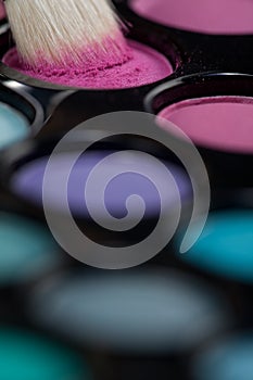 Eyeshadow set with makeup brush picking up color