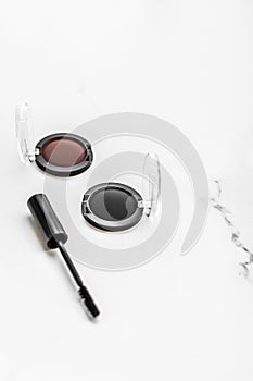 Eyeshadows, black liner and mascara on marble background, eye shadows cosmetics as glamour make-up products for luxury beauty