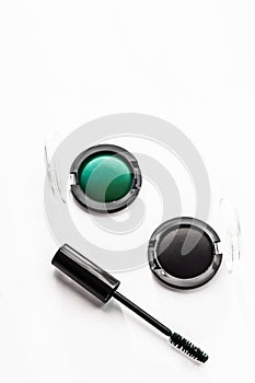 Eyeshadows, black liner and mascara on marble background, eye shadows cosmetics as glamour make-up products for luxury beauty
