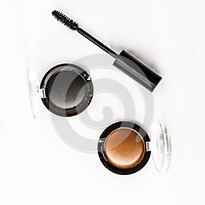 Eyeshadows, black liner and mascara on marble background, eye shadows cosmetics as glamour make-up products for luxury beauty