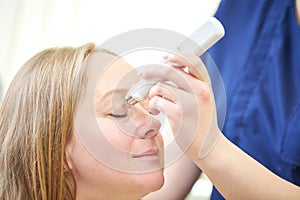 Eyesight care . doctor measure eye pressure from female patient