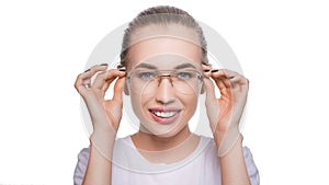 Eyewear glasses woman happy holding showing her new glasses smiling on white background. Beautiful young Caucasian