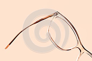 Eyewear spectacles close up isolated on beige background